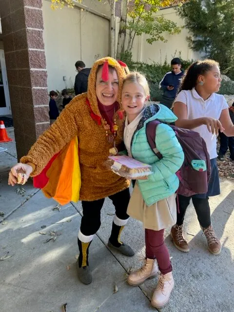 Teacher in costume with student